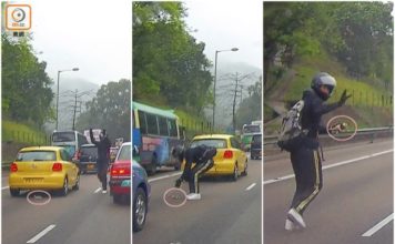 Il motociclista di Hong Kong salva un gattino rosso intrappolato nel traffico dell'ora di punta